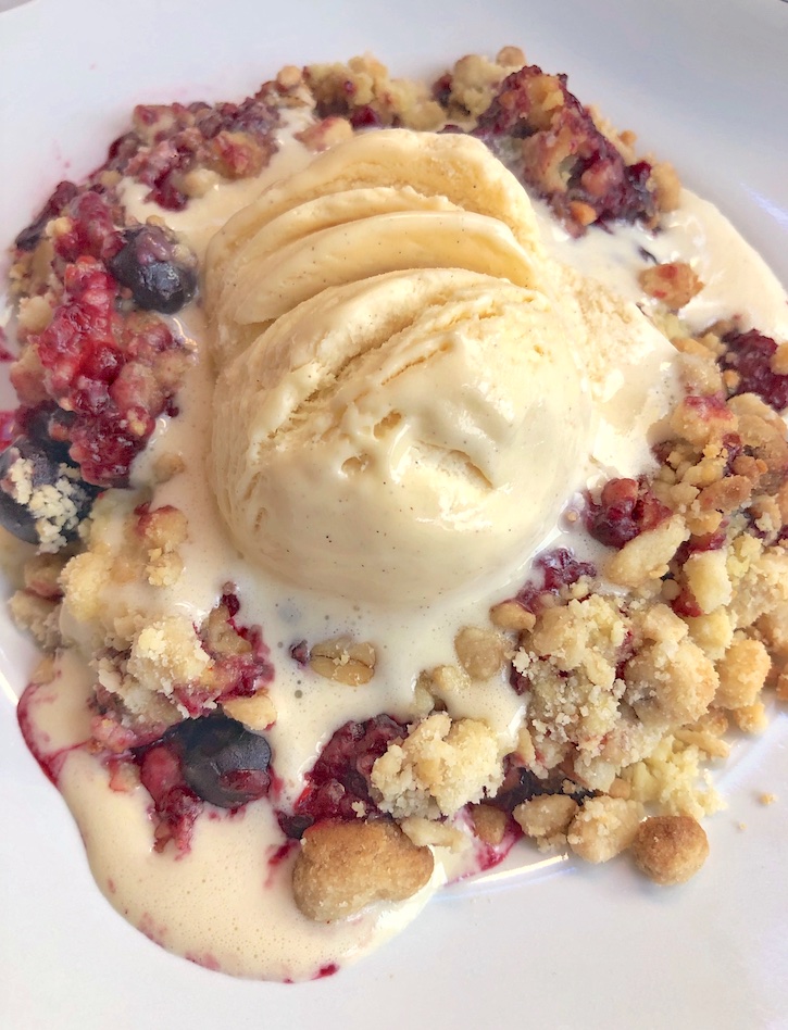 Easy frozen berry cobbler made with yellow cake mix, oats, butter and walnuts! Super easy and delicious.