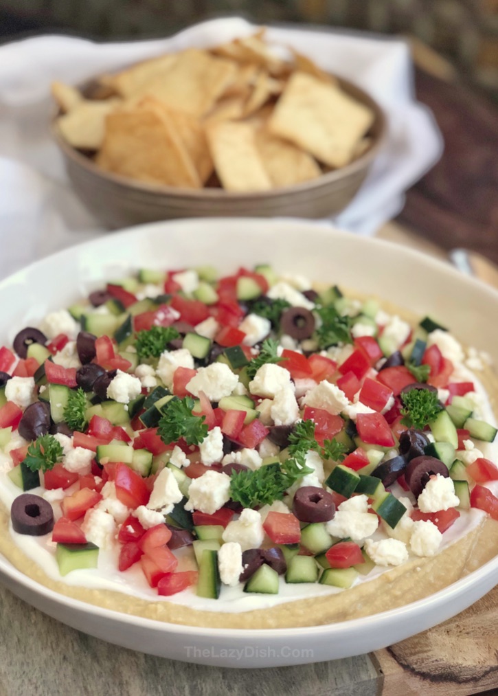 7 Layer Greek Hummus Dip - super easy appetizer idea for a crowd! Make ahead, no bake, healthy, vegetarian, simple and quick!