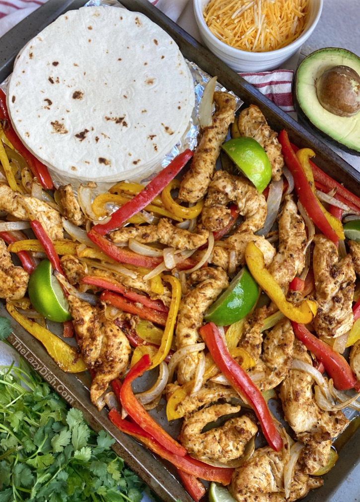 Easy oven baked chicken fajitas made on a sheet pan! A family favorite dinner recipe.