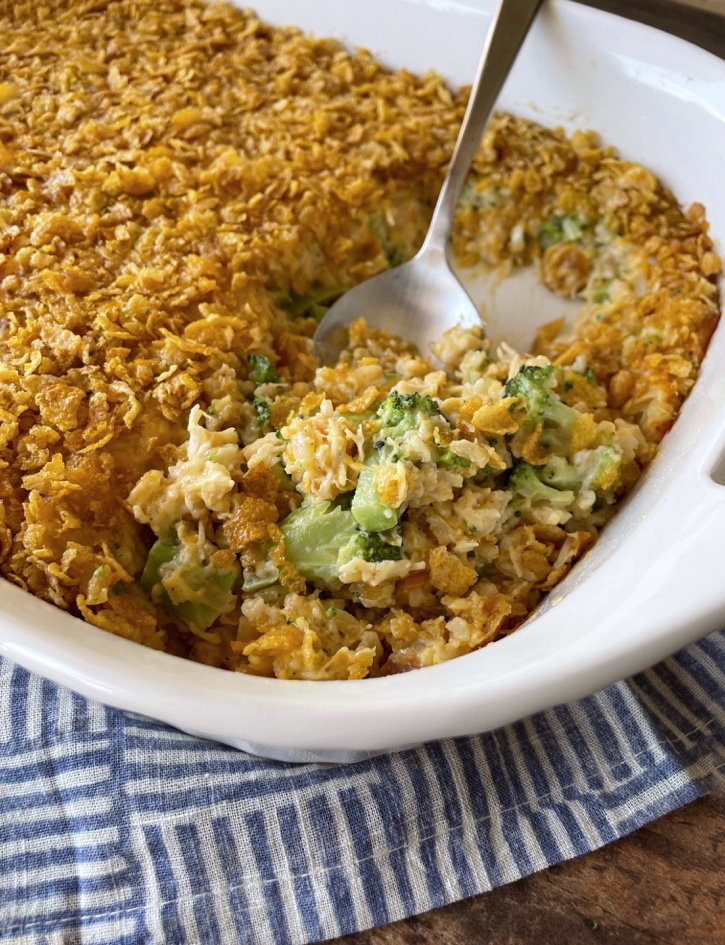 Easy Rice Casserole... made with canned chicken, broccoli, and lots of cheddar cheese! My picky family loves this simple and quick weeknight meal. We make it often! Everyone always goes back for seconds. 