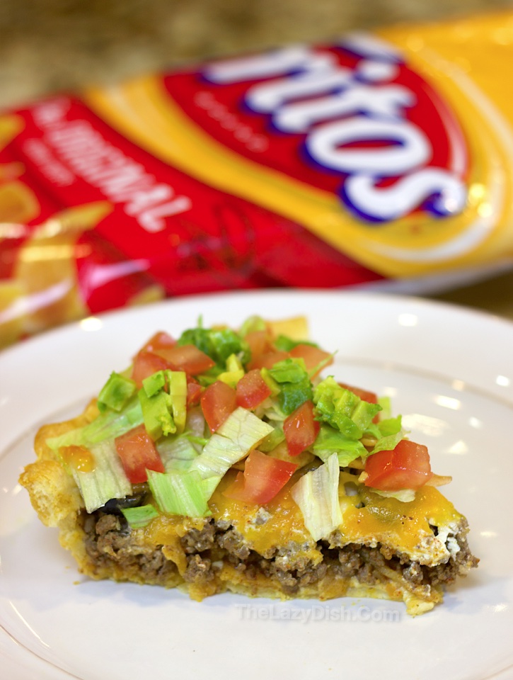 Looking for easy dinner recipes for your picky kids? This ground beef taco casserole is amazing! It has a Pillsbury crescent dough crust that makes it super fun and tasty. It's really quick, easy and cheap to make with just a handful of ingredients including ground beef, cheese, and Fritos corn chips. 