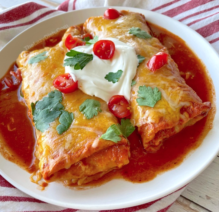 The best lazy day meal! This frozen burrito enchilada casserole is so quick and easy to make with just 3 ingredients! Frozen burritos, enchilada sauce, and shredded cheese. The best food hack I've ever come across. 