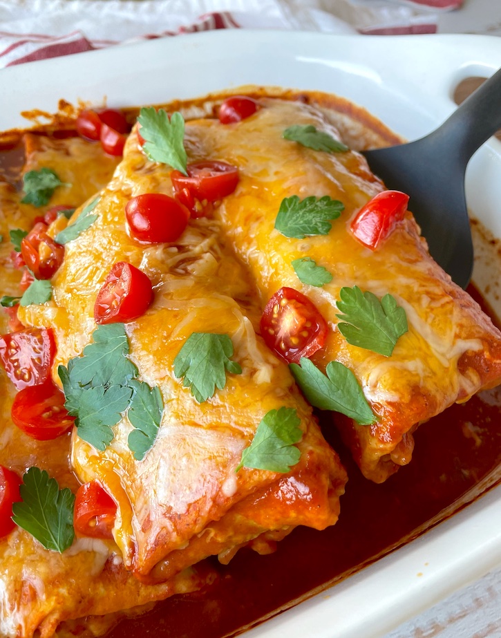 The best lazy day meal! This frozen burrito enchilada casserole is so quick and easy to make with just 3 budget ingredients: Frozen burritos, enchilada sauce, and shredded cheese. The best food hack I've ever come across. This makes a large portion for a big family.