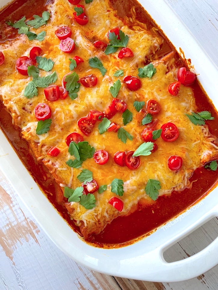 How to make frozen burritos awesome! These are the easiest enchiladas you'll ever make. My favorite dinner hack on busy weeknights. Simply smother frozen burritos with enchilada sauce and cheese. Bake and enjoy!