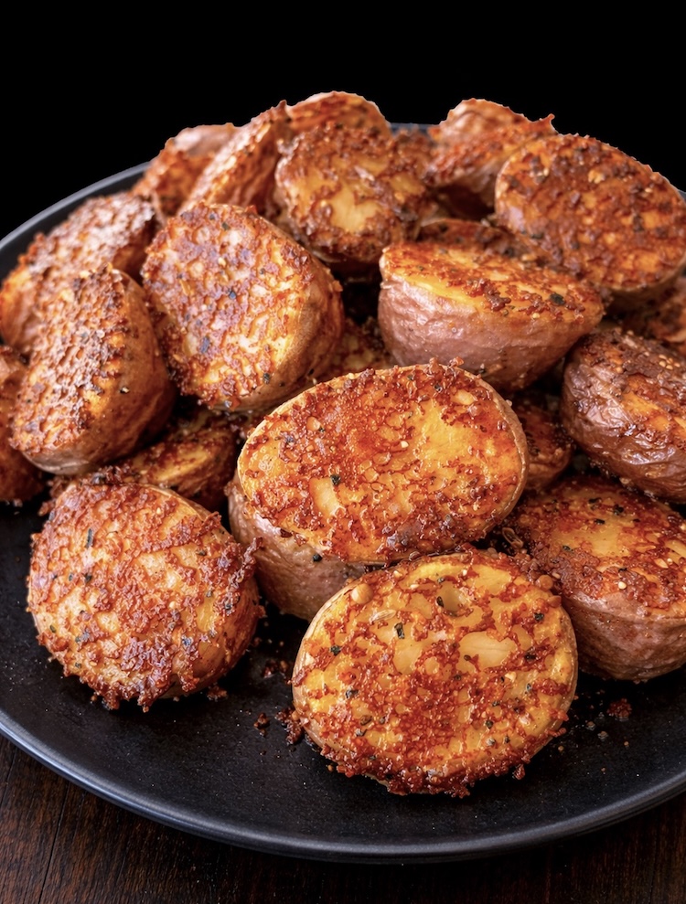 How to make delicious crispy roasted potatoes with butter and grated parmesan cheese. a delicious comfort food side dish that will impress your family. 