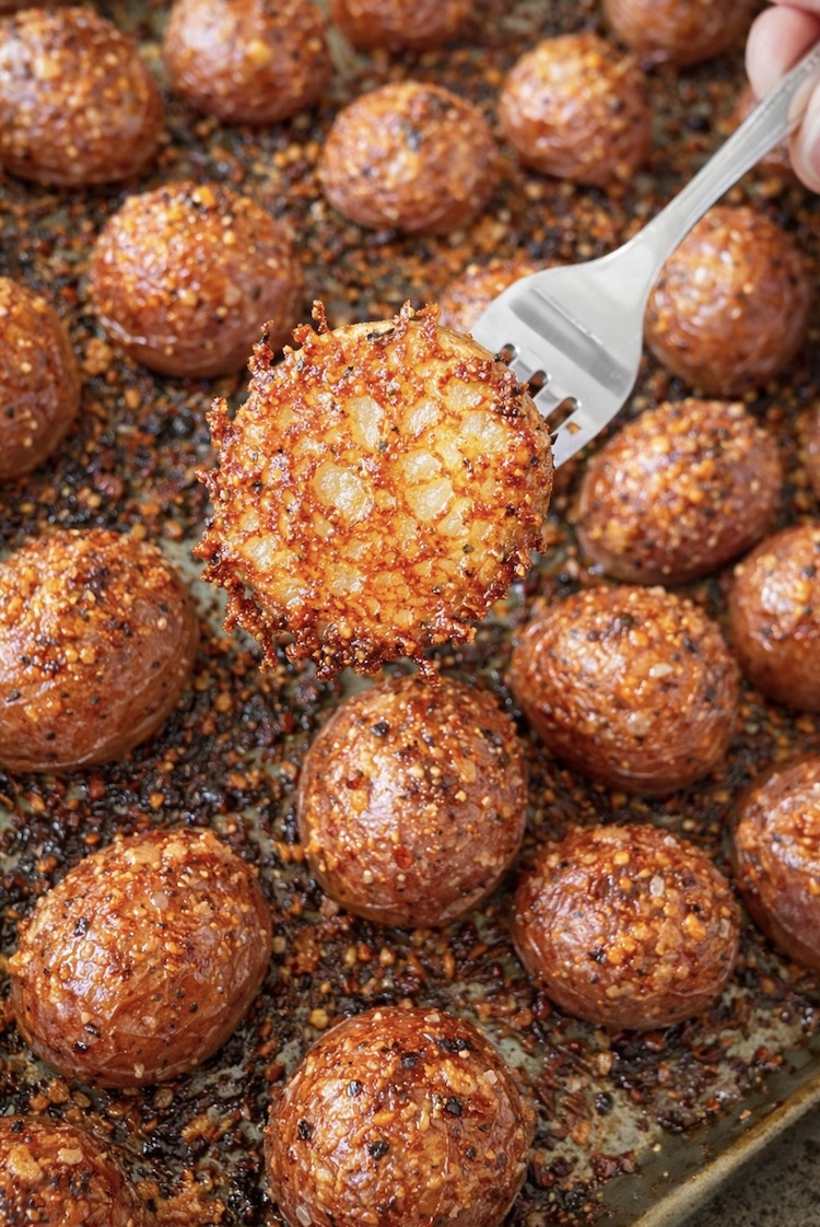 Yummy roasted potatoes just out of the oven baked with parmesan cheese and lots of melted butter. 