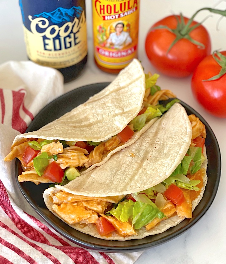 Are you looking for quick and easy weeknight meals for a family with kids? These slow cooker chicken enchilada tacos are super yummy and versatile for your picky eaters.