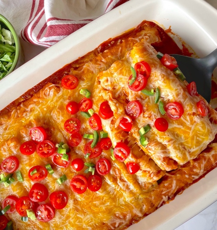 Lazy Enchilada Casserole (Made with chicken or beef frozen taquitos!) This quick and easy dinner recipe is a family favorite meal on busy school nights. My picky kids love it!