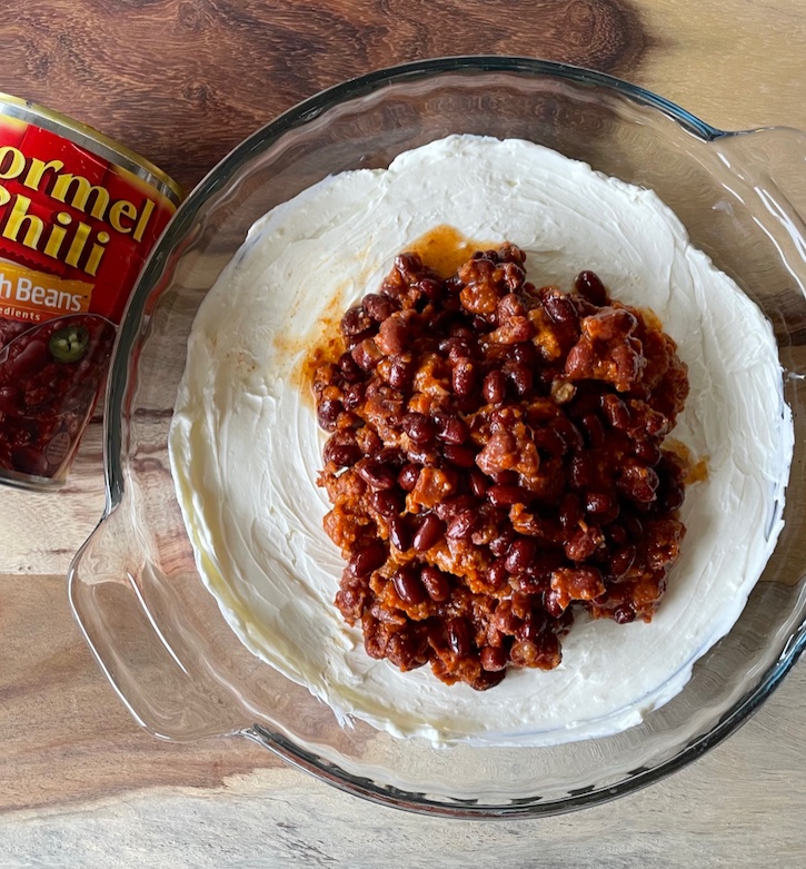 Warm Chili Cream Cheese Dip! A delicious and easy party food. It's warm, cheesy, quick to make, and crowd pleasing!