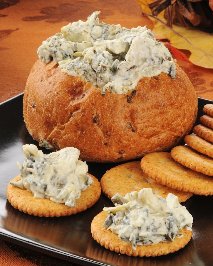 Cream Cheese Party Dip Idea... made with spinach and artichokes! This make ahead appetizer is perfect for parties. It feeds a crowd and is really addicting. 