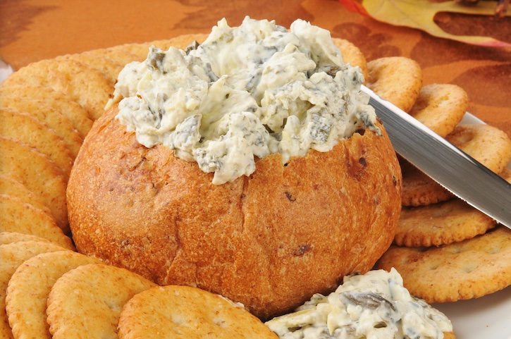 If you're hosting a party, you've got to make this quick and easy cold party dip! This spinach dip is made with cream cheese, Knorr seasoning, spinach, artichoke hearts, parmesan cheese and sour cream. No mayo!! Serve with crackers and bread for the best finger food you'll ever make!