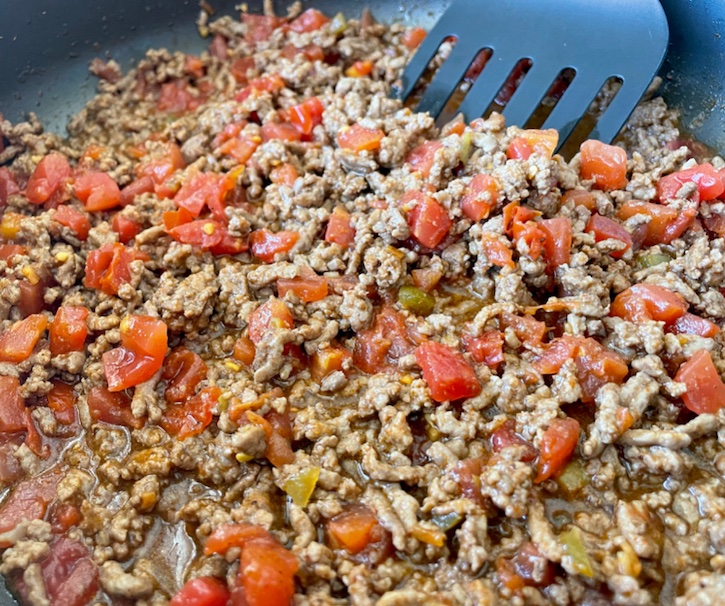 Seasoned ground beef mixed with a can of Rotel diced tomatoes and green chiles. 