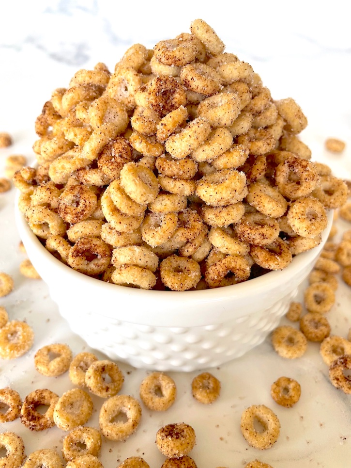 Are you looking for fun and easy snacks to make? You've got to try these hot buttered mini donuts made with Cheerios cereal! Too them with hot butter, sugar, and cinnamon for the best sweet treat you'll ever make. 