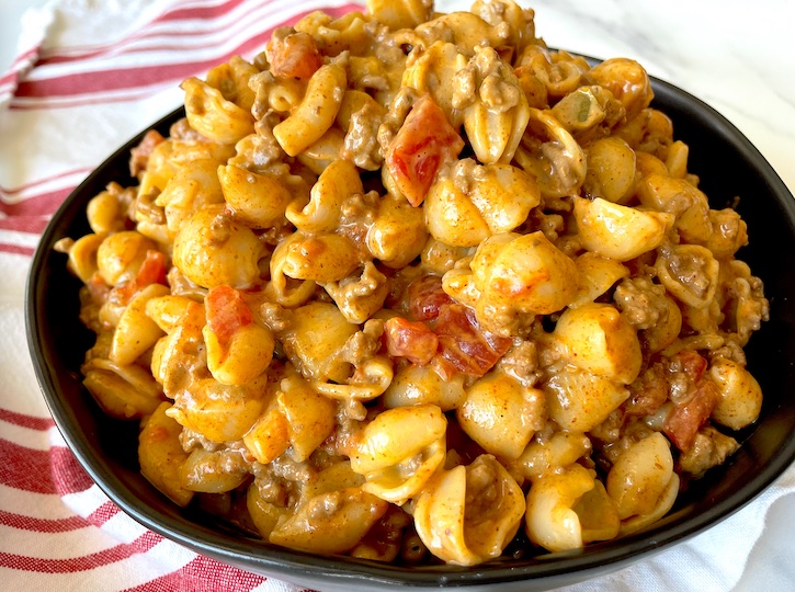 Cheesy Macaroni with taco beef! The ultimate comfort food. This lazy meal is a family favorite. 