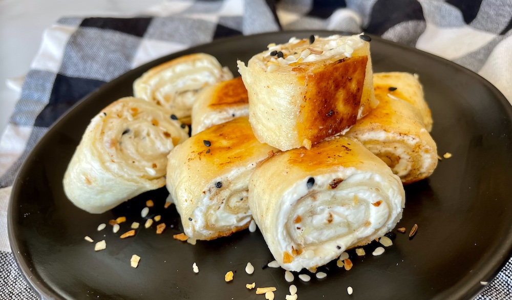 You're going to love this fun and easy snack idea! Crispy Bagel Bites are made with just a few ingredients including flour tortillas, cream cheese, butter, and seasoning. A quick snack or simple breakfast! My kids love them.