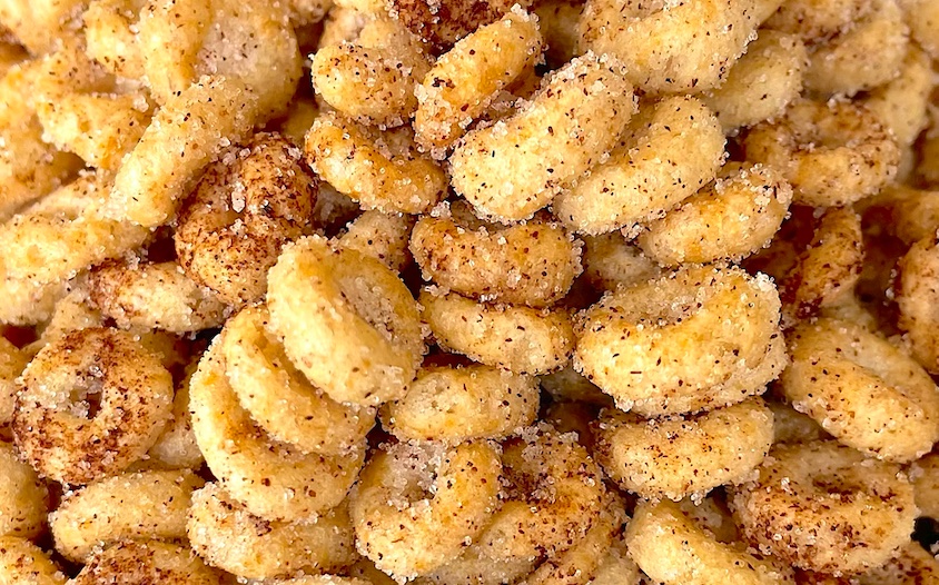 This fun and easy snack is so easy to make with just a few ingredients. Simply soak Cheerios in hot butter, and then coat with a mixture of cinnamon and sugar. So yummy! My favorite crunchy snack.