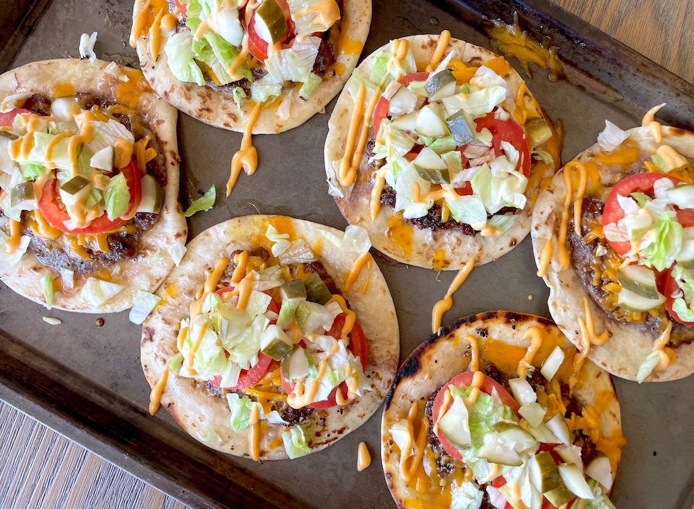 Smash Burger Tacos are a fun and trending dinner recipe combining classic cheeseburger ingredients in the form of a taco with flour tortillas instead of buns.