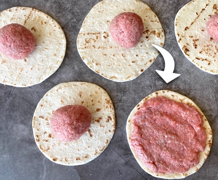 How to make Smashed Cheeseburger Tacos! Simply smash raw ground beef into a thin layer on flour tortillas and cook on a Blackstone griddle or pan on your stove. 