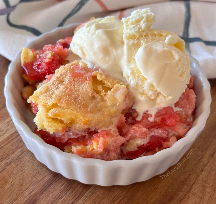 Check out this easy to make dessert idea for your next party or heck even just for after dinner tonight. With 4 ingredients including crushed pineapples, cherry pie filling, dry cake mix, and butter you can make an easy dump cake that tastes just like homemade cobbler. Add a scoop of ice cream on top and you have the best dessert ever. 