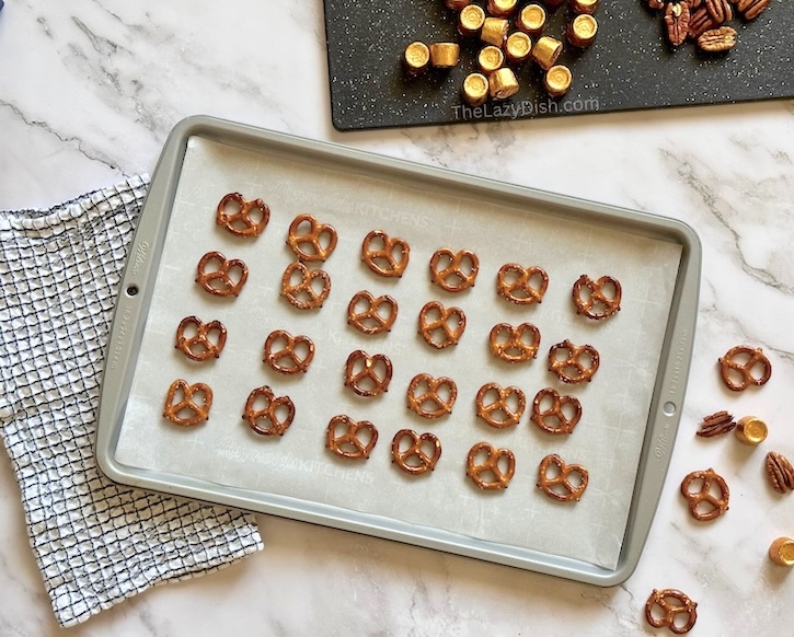 Step by step instructions on how to make pretzels with melted Rolo candy and pecans.