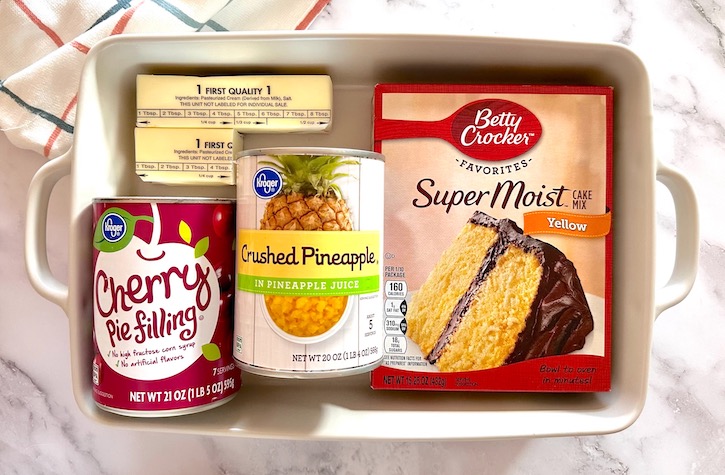 Ingredients needed for pineapple dump cake, an easy dessert recipe made with just a few simple and cheap ingredients
