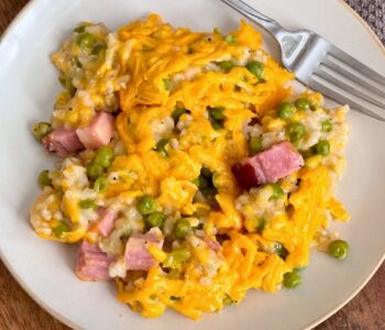 I’m always looking for a cheap dinner recipe that is easy to make on busy weeknights, and this cheesy ham and pea casserole is perfect! I make this delicious recipe extra lazy by making it ahead of time and simply throwing it into the oven when we get home. All you do is mix all the ingredients together, top with cheese and bake until bubbly and creamy. This cheesy rice casserole is perfect for picky eaters! Oh so yummy.