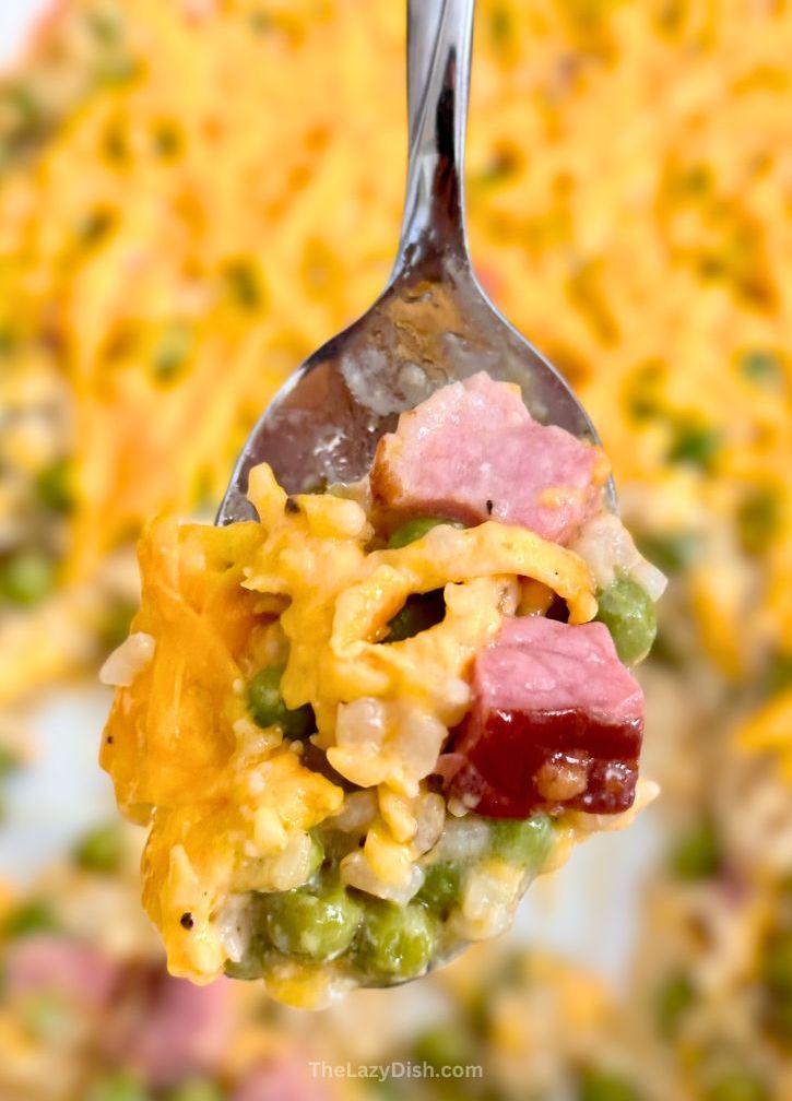 This cheesy dinner casserole is made with just a few simple and cheap ingredients including instant rice, cooked ham, and frozen peas, making it extra lazy for busy weeknight meals. My kids love it! If you have picky eaters to feed, this quick meal is for you. I make it often on busy school nights because I can get several meals out of it. It’s just as good leftover! You can use any veggies that you’d like to make it different every time.
