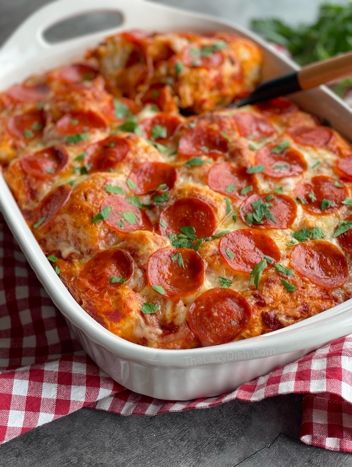 This pepperoni pizza casserole is made with just four ingredients: Pillsbury refrigerated biscuits, pizza sauce, cheese, and the toppings of your choice, making for a quick and easy dinner for a family with kids. 