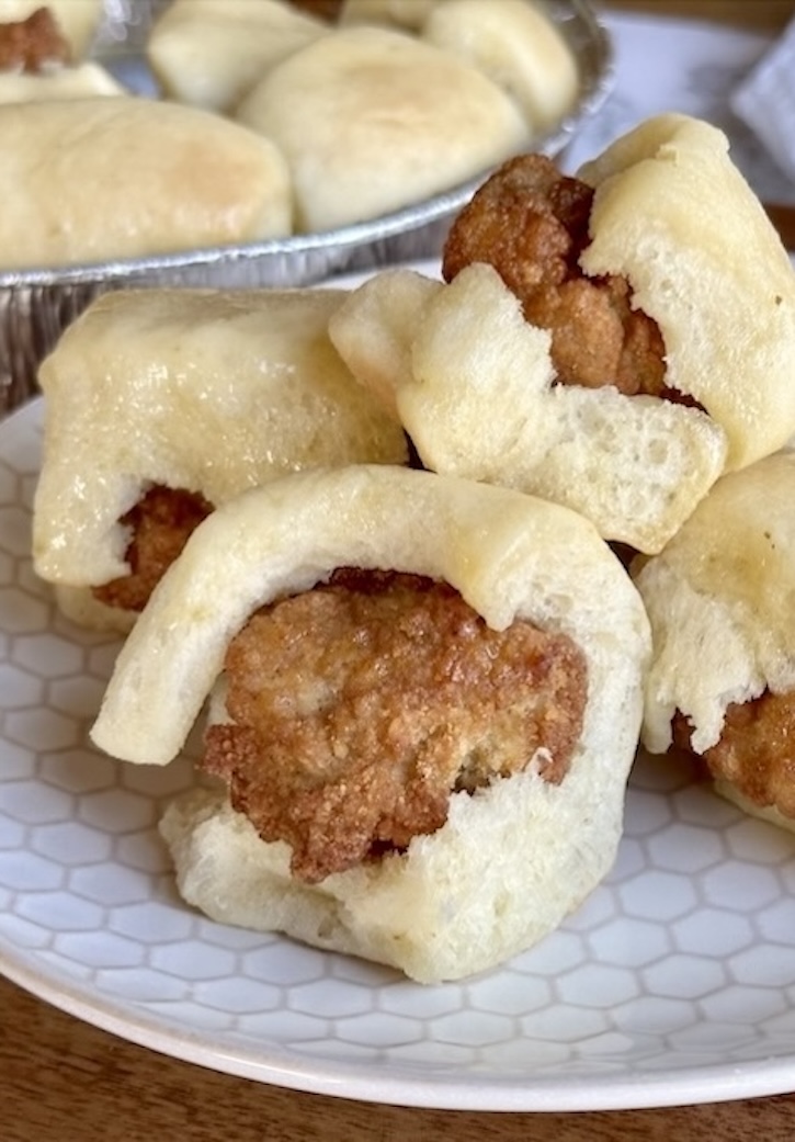 How to make Copycat Chick-fil-A Chicken Minis at home with frozen rolls and popcorn chicken! Smother them in a mixture of honey and melted butter to make this popular breakfast that your kids will love!