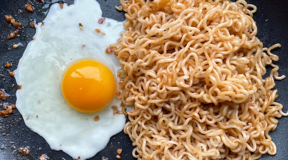 Yummy ramen noodle stir fry dinner made with eggs.