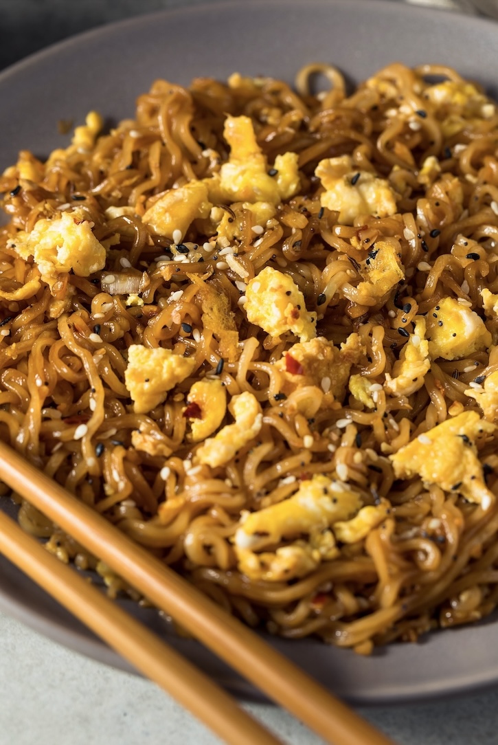 Popular ramen noodle stir fry recipe tossed with egg and a sweet and savory garlic sauce. 