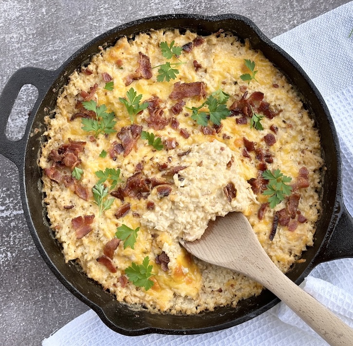 Are you looking for a simple dinner idea that your whole family will love? This easy to make chicken casserole is creamy, delicious, and secretly full of vegetables. My kids didn't even notice they were eating cauliflower rice! Buffalo chicken cauliflower casserole for the win!