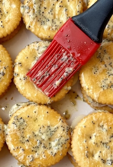 Buttery Ritz Cracker Sandwiches, baked with a layer of ham and cheese!