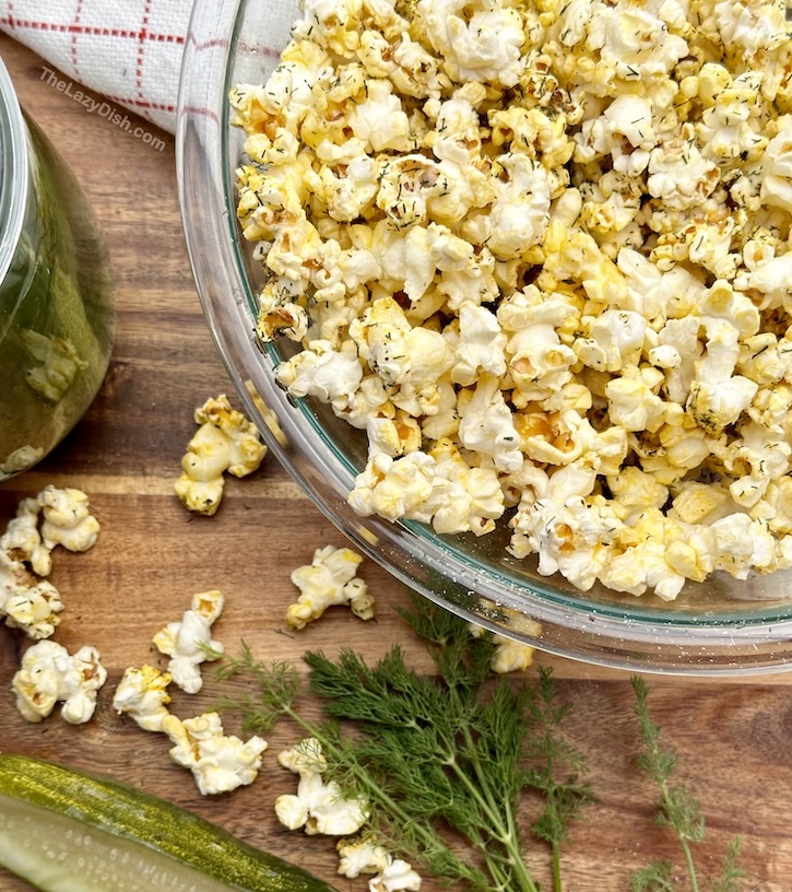 Pickle flavored popcorn may be the world's best snack! Salty, tangy and wildly addicting this simple to make popcorn recipe is made extra lazy with just a few simple ingredients. The perfect way to spice up regular popcorn! 