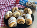 How to make a delicious 2 ingredient amazing breakfast recipe for special occasions! These yummy pigs in a blanket are quick and easy to make with frozen sausage links and Pillsbury Cinnamon Rolls. A fun breakfast idea for birthdays, holidays, family gatherings, sleepovers, and lazy Sundays at home with the kids.
