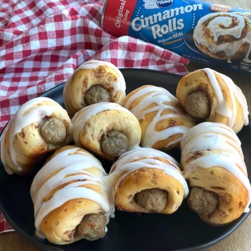 How to make a delicious 2 ingredient amazing breakfast recipe for special occasions! These yummy pigs in a blanket are quick and easy to make with frozen sausage links and Pillsbury Cinnamon Rolls. A fun breakfast idea for birthdays, holidays, family gatherings, sleepovers, and lazy Sundays at home with the kids.
