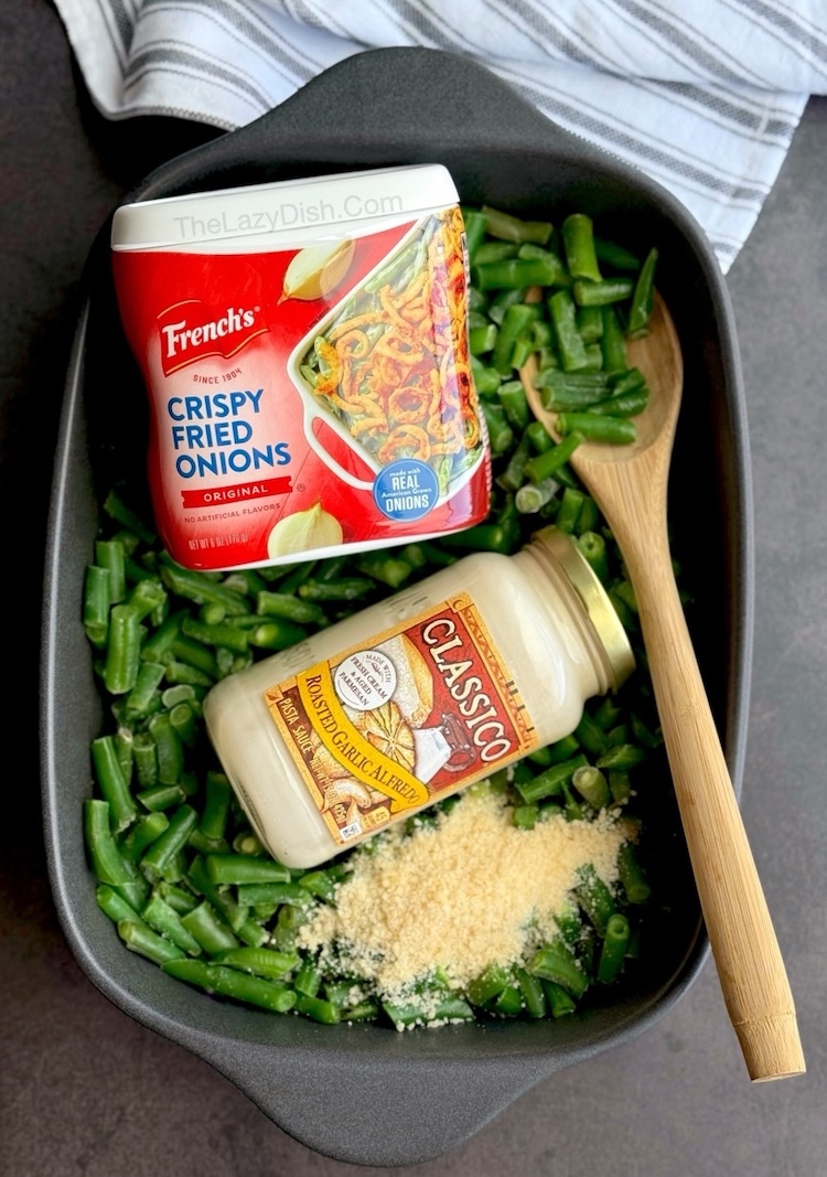 Quick and easy green bean casserole vegetable side dish made with a jar of Alfredo sauce, frozen green beans, and crispy French fried onions. 