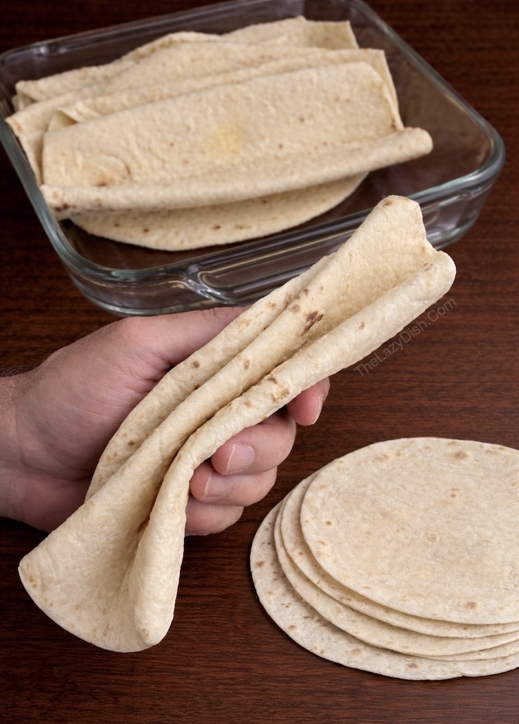 How to fold flour tortillas like an accordion for making cheesy stuffed garlic herb pull apart baked bread.