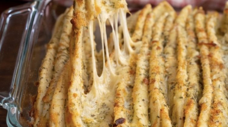 Close up view of fresh out of the oven baked garlic bread made with flour tortillas, mozzarella cheese, and garlic olive oil.